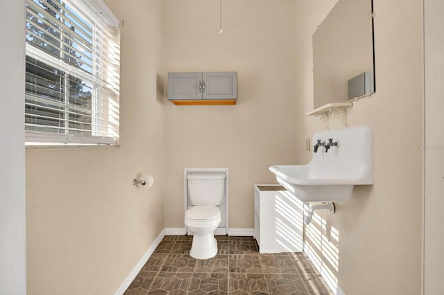 bathroom with toilet and sink