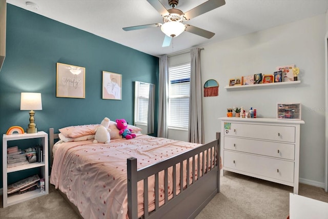 carpeted bedroom featuring ceiling fan