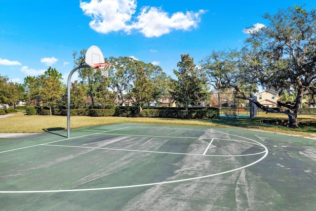 view of basketball court featuring a lawn