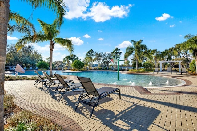 view of swimming pool featuring a pergola, a patio area, and pool water feature