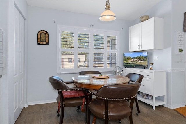 dining area featuring dark hardwood / wood-style floors