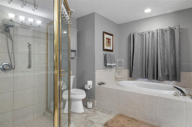 bathroom featuring a textured ceiling, toilet, and independent shower and bath