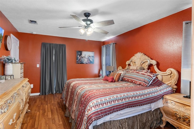 bedroom with hardwood / wood-style flooring and ceiling fan