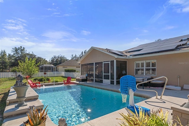 view of swimming pool with a sunroom, a patio, and pool water feature