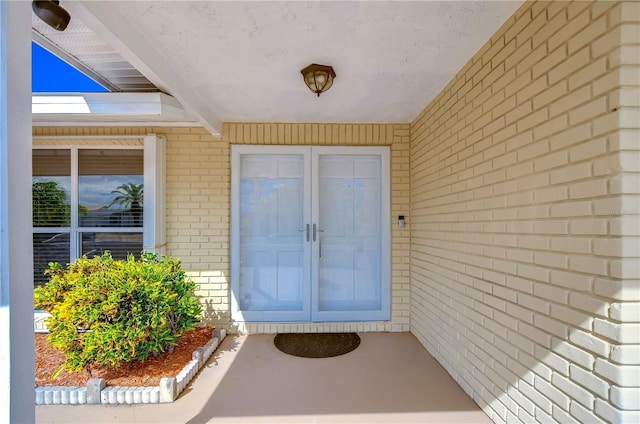 property entrance featuring french doors