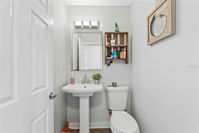 bathroom with sink and toilet