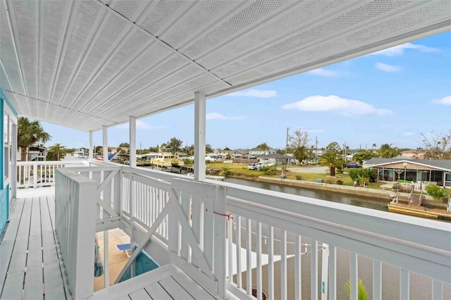 wooden deck with a water view