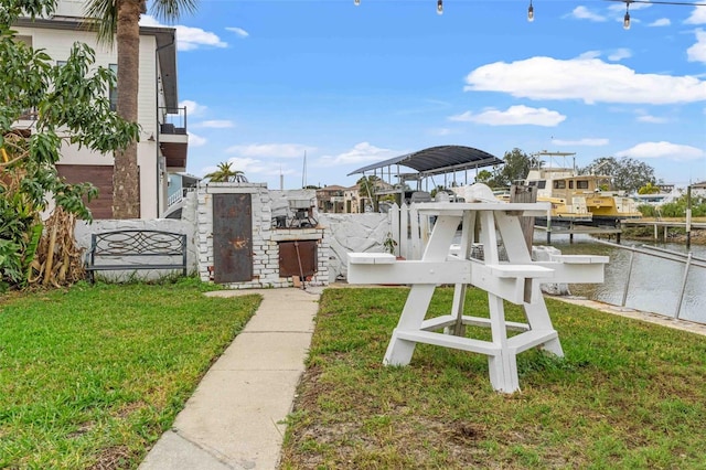 exterior space with a yard and a boat dock