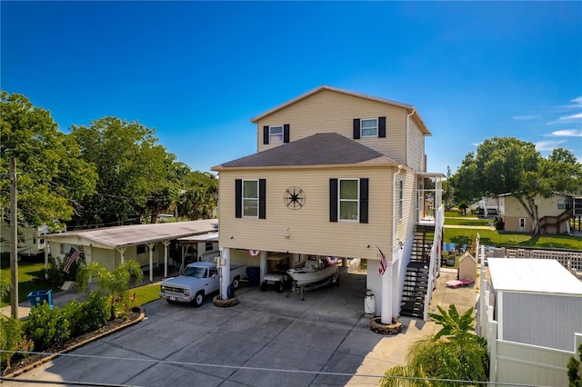 rear view of property featuring a carport