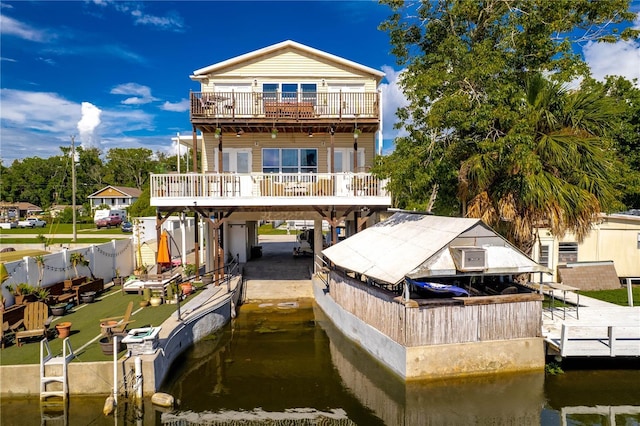 back of house with a water view