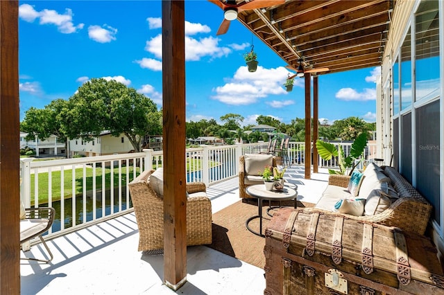 balcony featuring ceiling fan and an outdoor hangout area