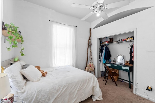 bedroom featuring light carpet, a closet, and ceiling fan