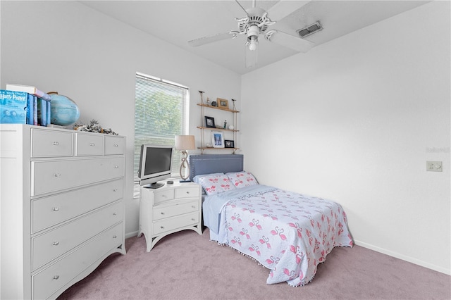 bedroom with ceiling fan and light colored carpet