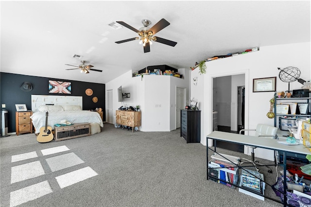 carpeted bedroom with ensuite bathroom, vaulted ceiling, and ceiling fan