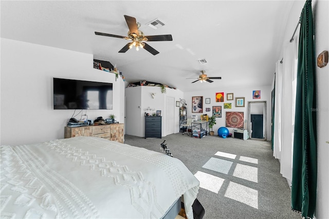 bedroom with ceiling fan, carpet, and vaulted ceiling