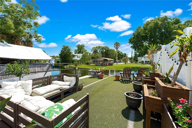 view of yard with an outdoor hangout area and a water view