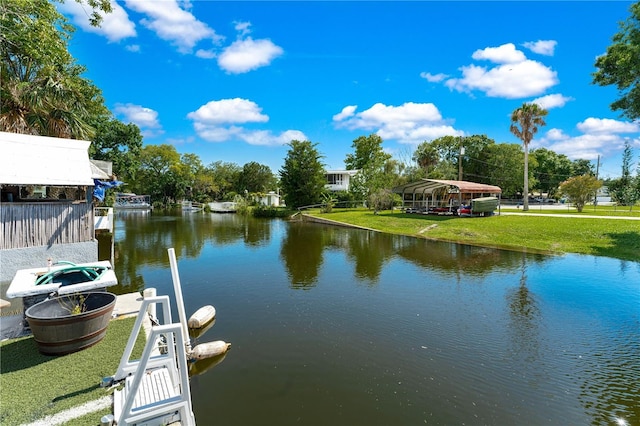 dock area featuring a yard and a water view