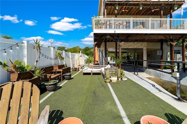 view of yard featuring an outdoor hangout area, a deck, and a patio area