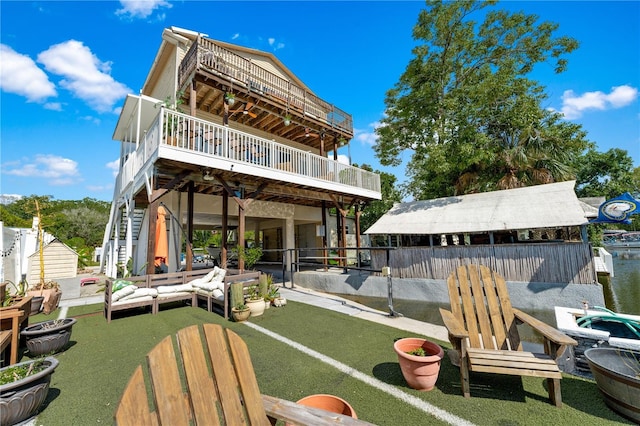 back of house featuring an outdoor hangout area