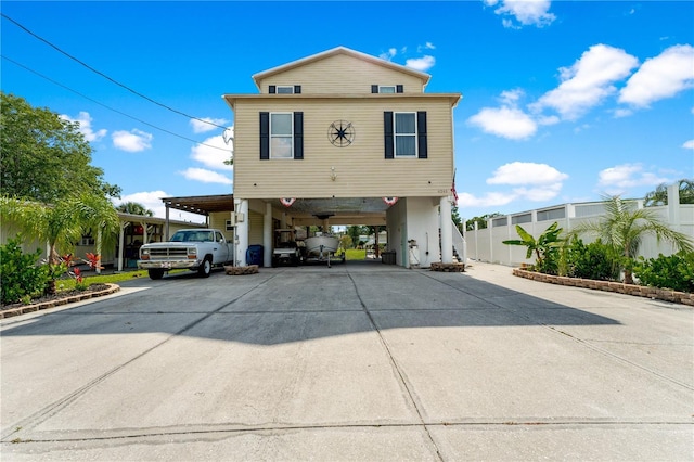 view of front property featuring a carport