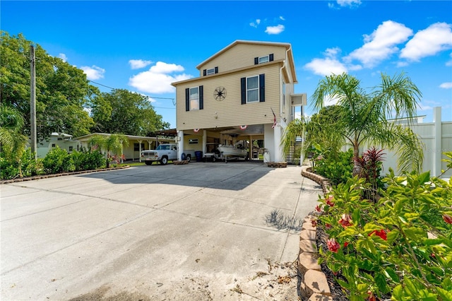 back of property featuring a carport