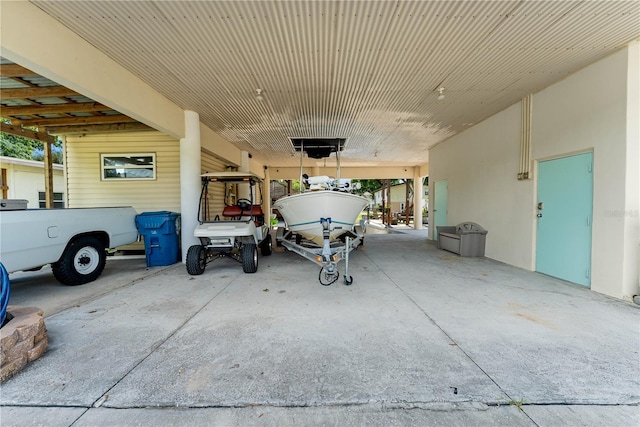 garage featuring a carport