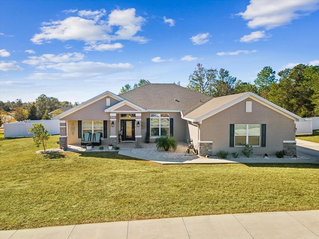 ranch-style house featuring a front lawn