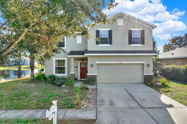 view of front of home featuring a water view and a garage