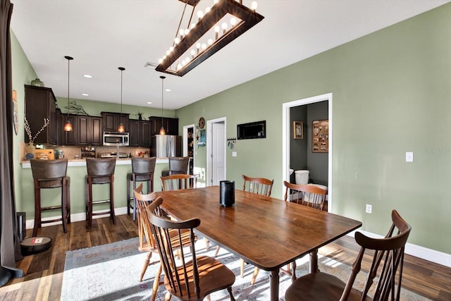 dining room with dark wood-type flooring