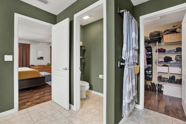 bathroom featuring tile patterned floors and toilet