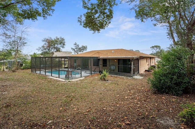 back of property featuring a sunroom and a patio