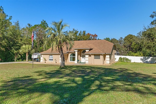 back of house featuring a lawn