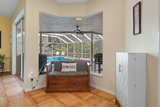 interior space featuring a swimming pool, light tile patterned flooring, and lofted ceiling