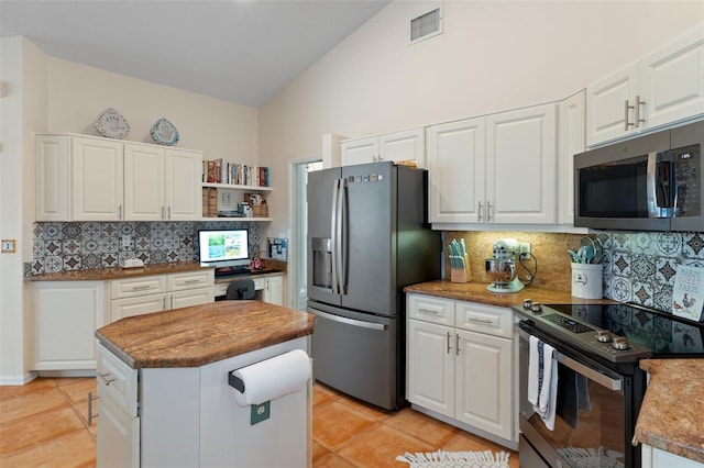 kitchen with a center island, white cabinetry, and stainless steel appliances