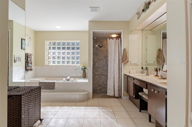 bathroom featuring tile patterned flooring, vanity, and independent shower and bath