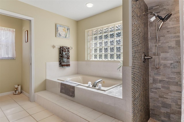 bathroom featuring tile patterned floors and independent shower and bath