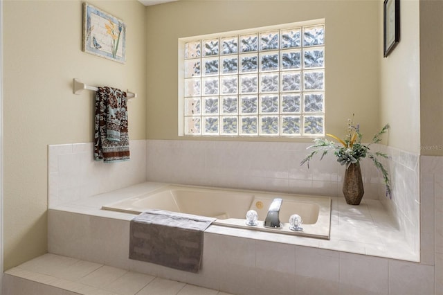 bathroom featuring tiled tub