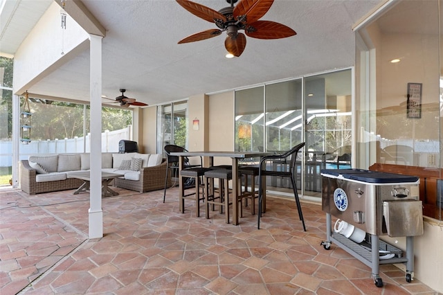 sunroom / solarium with ceiling fan