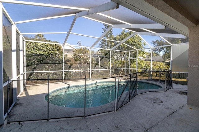 view of pool featuring a lanai and a patio