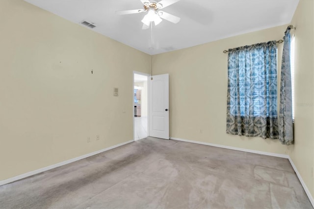 unfurnished room with ceiling fan and light carpet