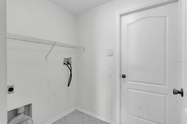 washroom with light tile patterned floors, hookup for a washing machine, and electric dryer hookup