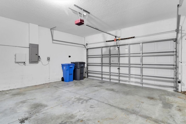 garage featuring a garage door opener and electric panel