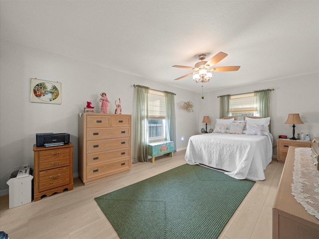 bedroom featuring ceiling fan and light wood-type flooring