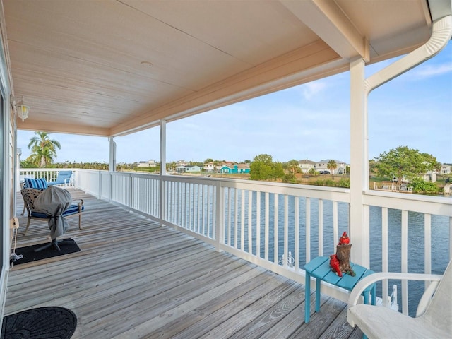 wooden deck with a water view