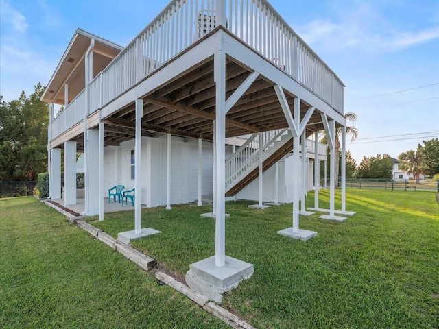 surrounding community featuring a lawn and a wooden deck