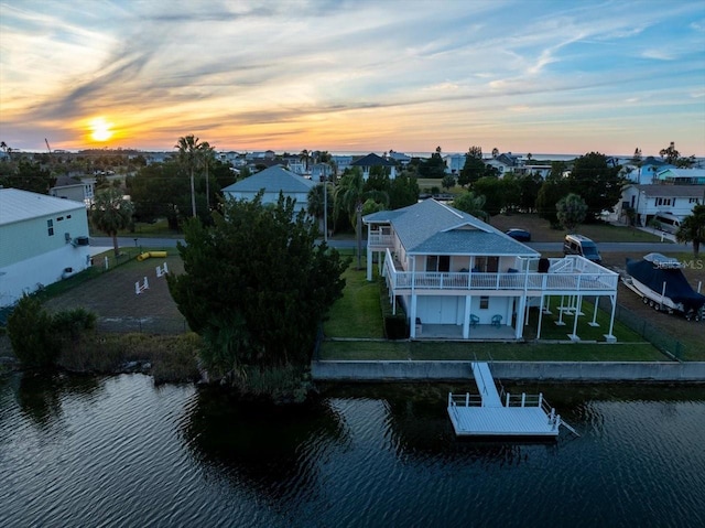 aerial view at dusk with a water view