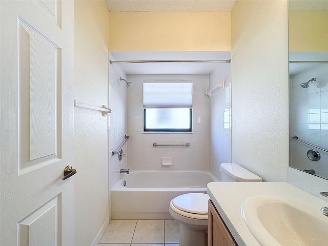 full bathroom with tile patterned floors, vanity, toilet, and tiled shower / bath