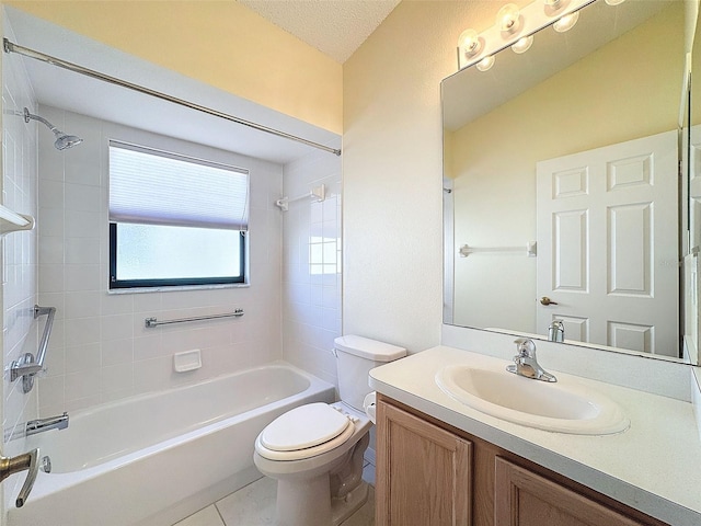 full bathroom featuring tile patterned floors, vanity, a textured ceiling, tiled shower / bath combo, and toilet