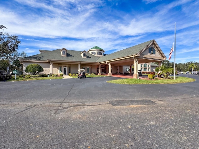 view of front of house with french doors and a carport