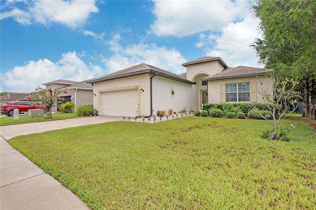 view of front of property featuring a front lawn and a garage